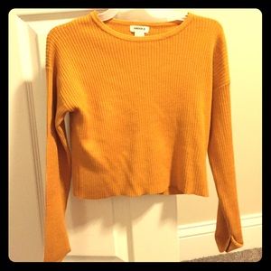 A Forever 21 mustard yellow long sleeved shirt.
